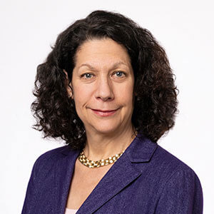 Headshot of Bonnie L. Bassler, Ph.D. wearing a white shirt