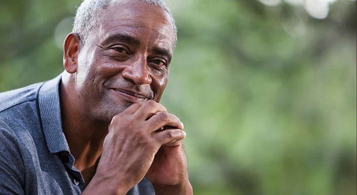 Older man smiling outdoors, illustrating lung health and healthy aging with COPD