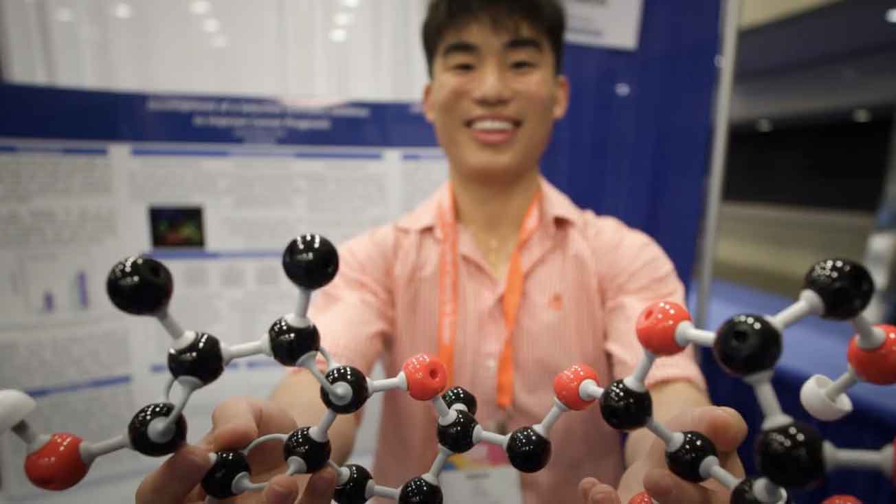  ISEF participant holding a molecular model