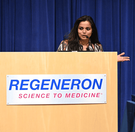  Person speaking from behind the REGENERON podium