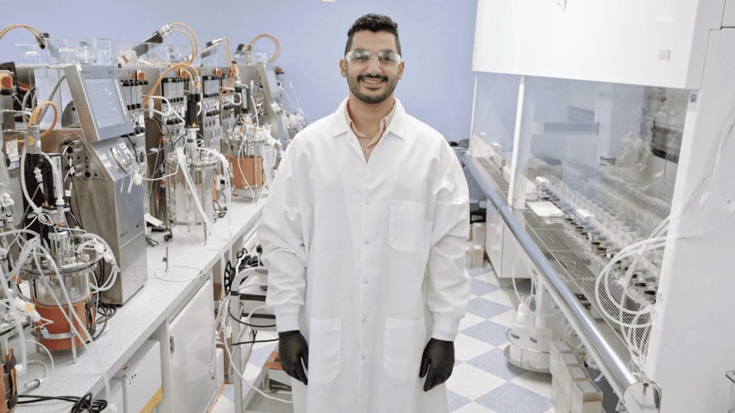  Video featuring a Regeneron scientist posing and smiling in a lab.