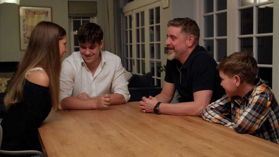   Campbell family sitting at a table