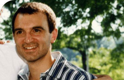 Co-Founder, Board co-Chair, President and CSO George Yancopoulos, MD, PhD, standing outside and smiling.
