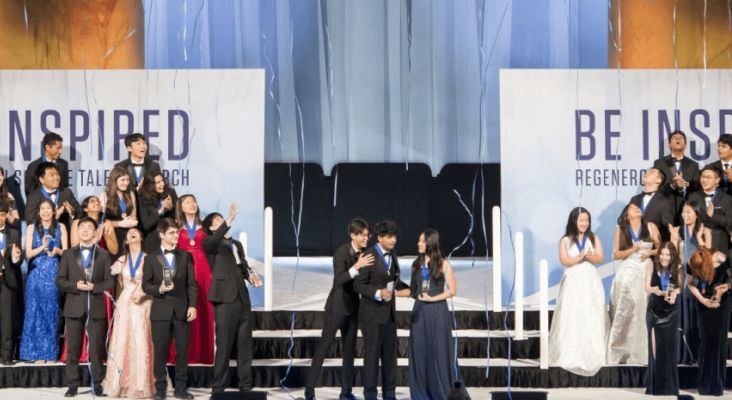 People standing on the Be Inspired stage