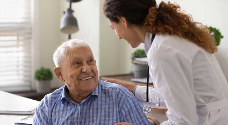 Healthcare professional speaking to a patient