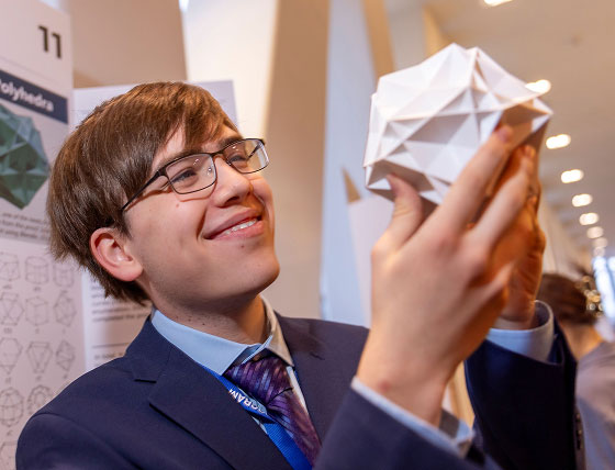 2026 Regeneron Science Talent Search winner Connor Hill holding a noble polyhedron