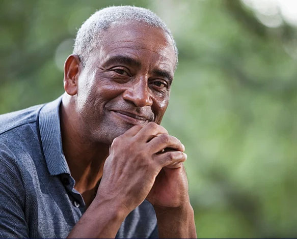 Older man smiling outdoors, illustrating lung health and healthy aging with COPD