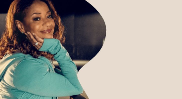 Debbie Allen (award-winning actress, dancer, and director) posing and smiling.