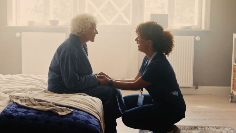 Health Care Professional helping elderly