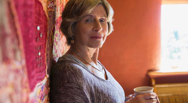 A Woman holding a mug