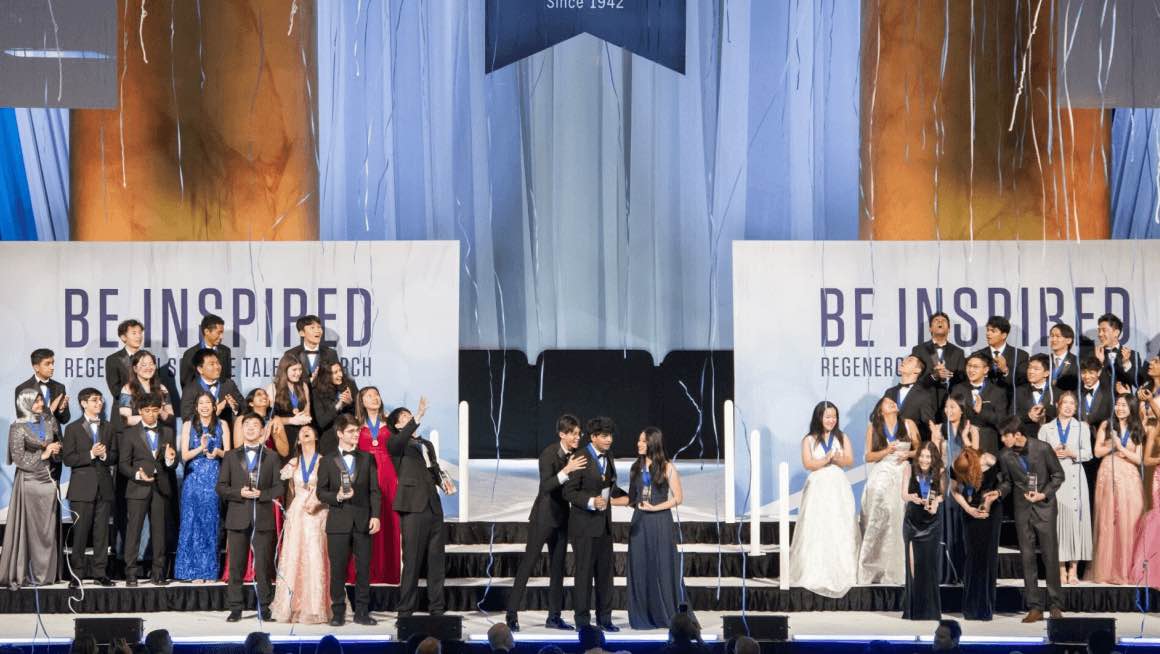 People standing on the Be Inspired stage