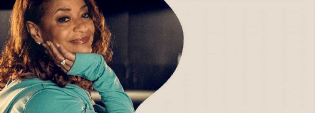 Debbie Allen (award-winning actress, dancer, and director) posing and smiling.