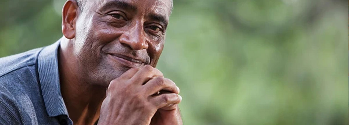Older man smiling outdoors, illustrating lung health and healthy aging with COPD